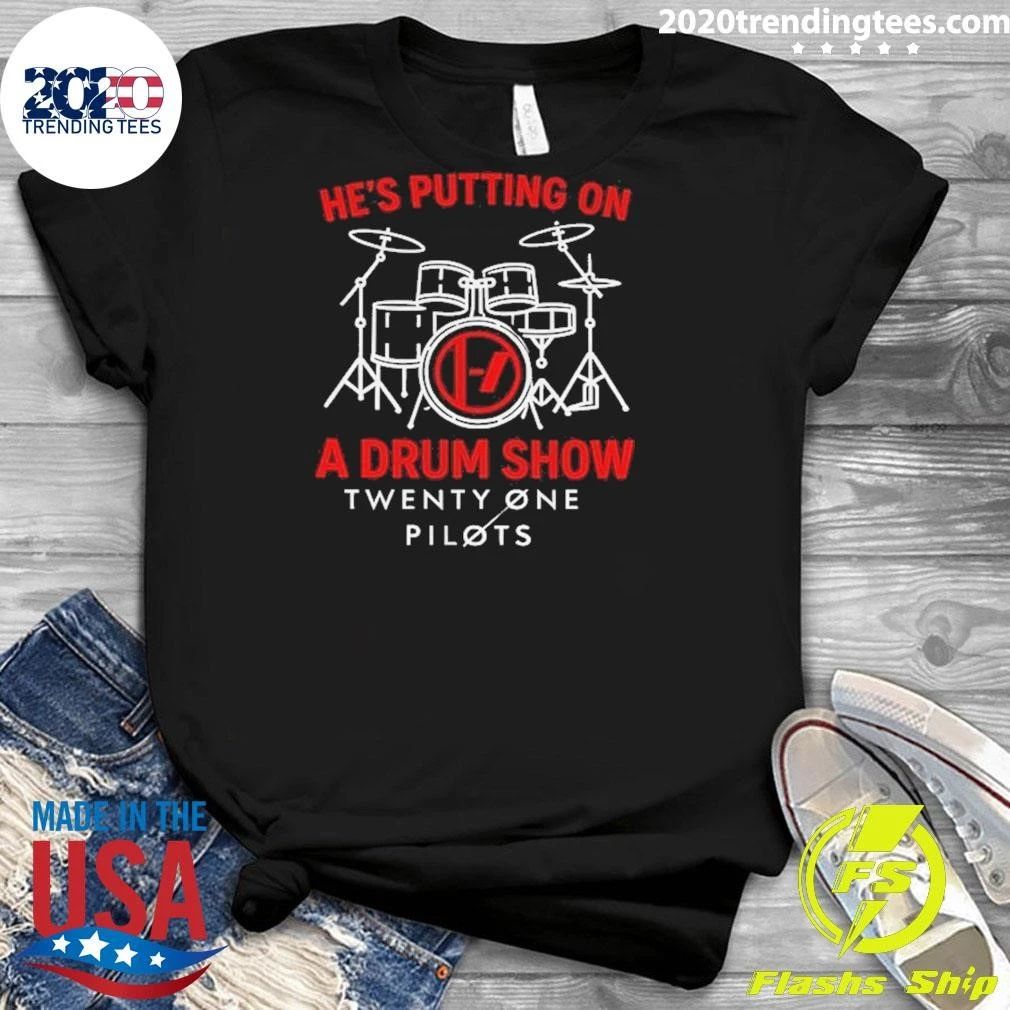 He’s putting on a drum show Twenty One Pilots shirt