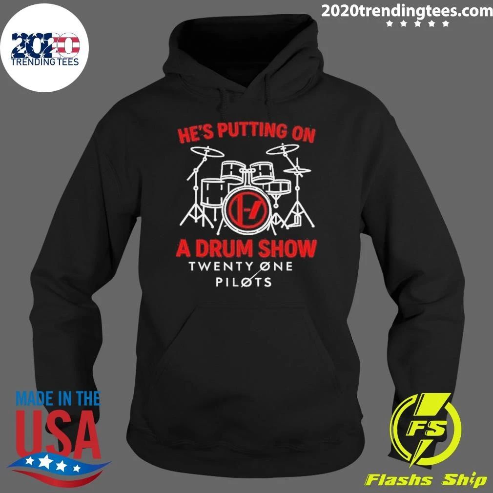He’s putting on a drum show Twenty One Pilots shirt